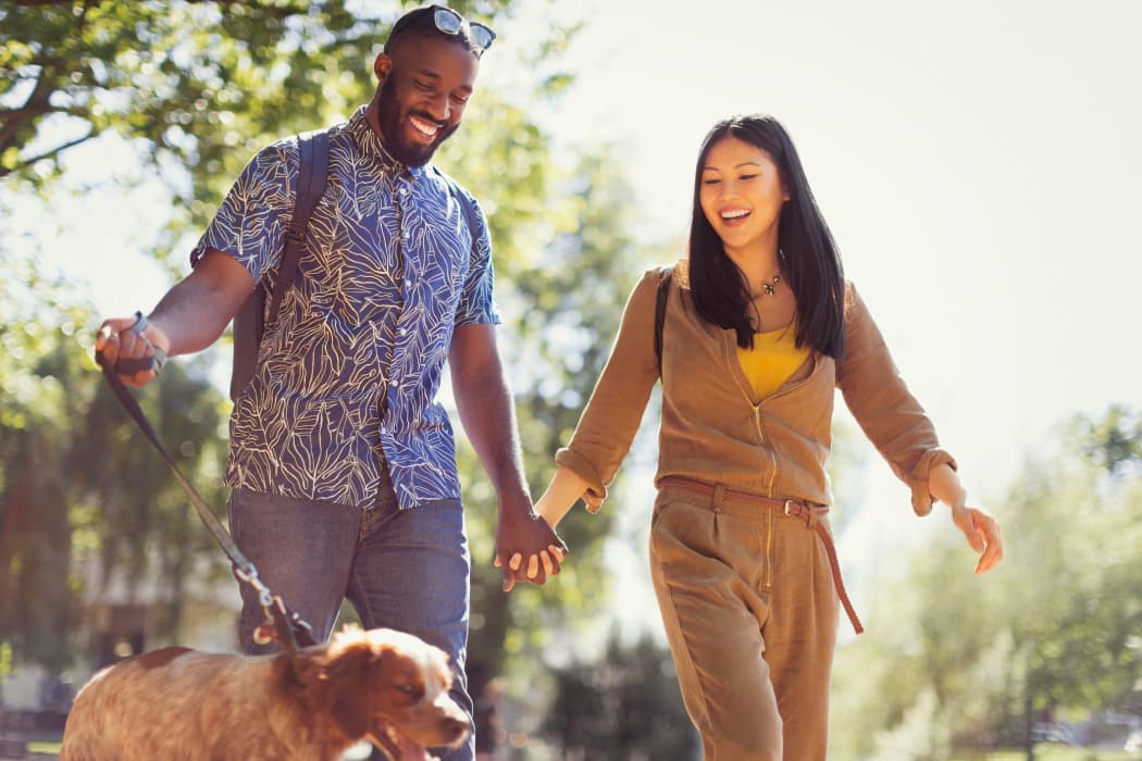 Residents taking their dog for a walk near IMT Rancho Serrano Townhomes in Thousand Oaks, CA