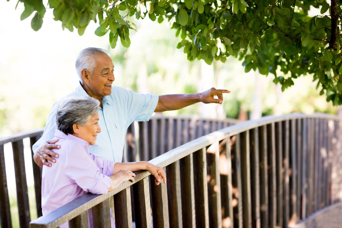 Two residents laughing together at Canoe Brook Assisted Living & Memory Care in Catoosa, Oklahoma