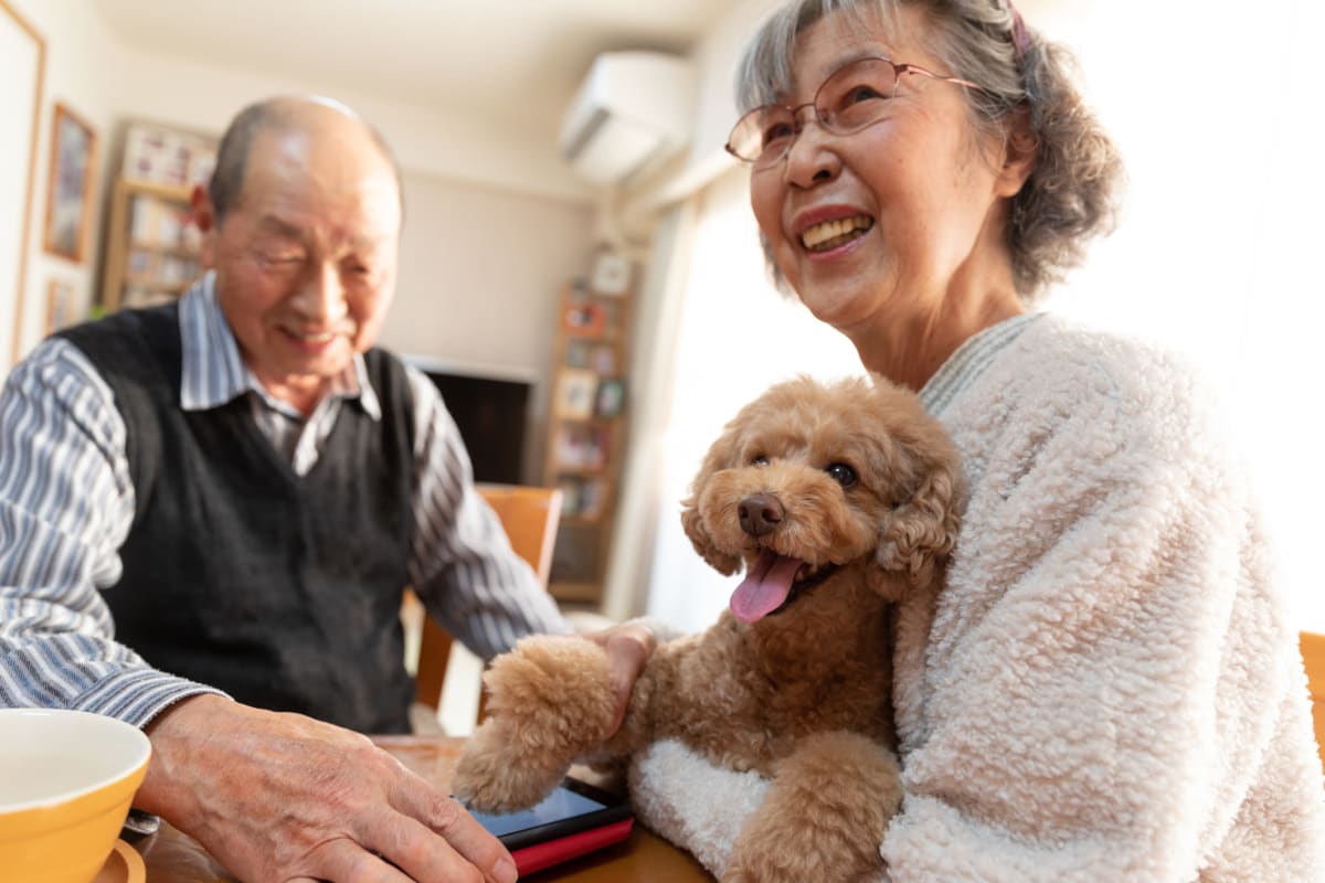 Residents with pet at MBK Senior Living