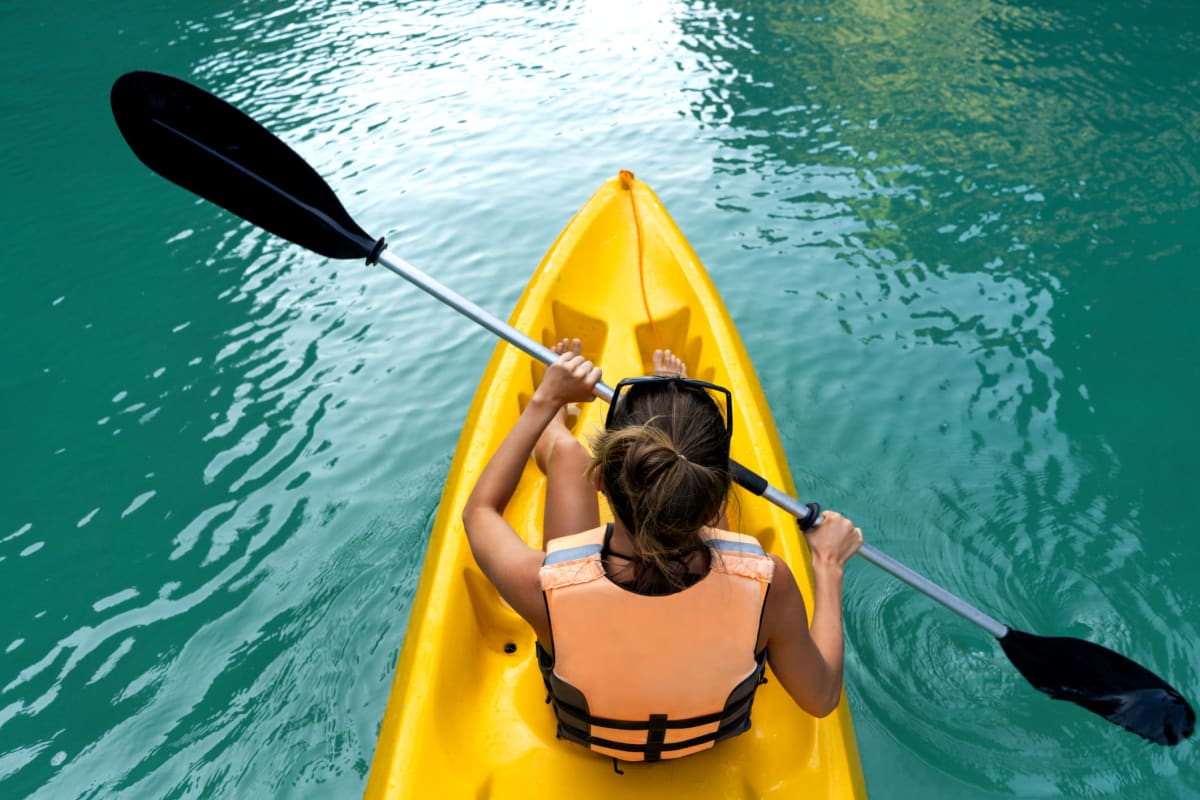 Resident going out on a kayak on the beautiful lake near BB Living Murphy Creek in Aurora, Colorado