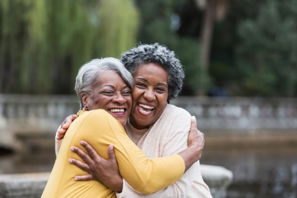 Residents share a hug at The Crossings at Eastchase in Montgomery, Alabama