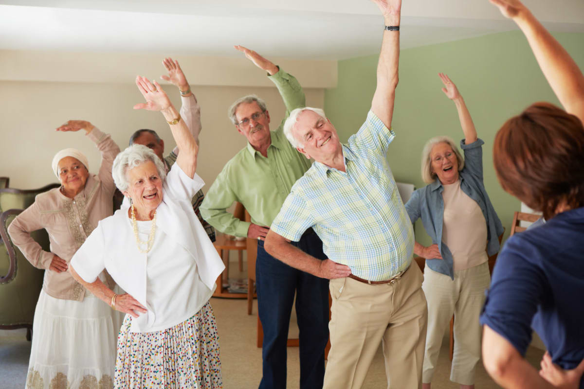 Residents enjoying stretching activities at The Fountains of Hope in Sarasota, Florida.