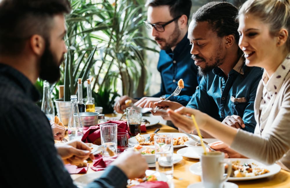 Residents and friends out enjoying a meal at a favorite local restaurant near The Waterford Apartments in Columbia, South Carolina
