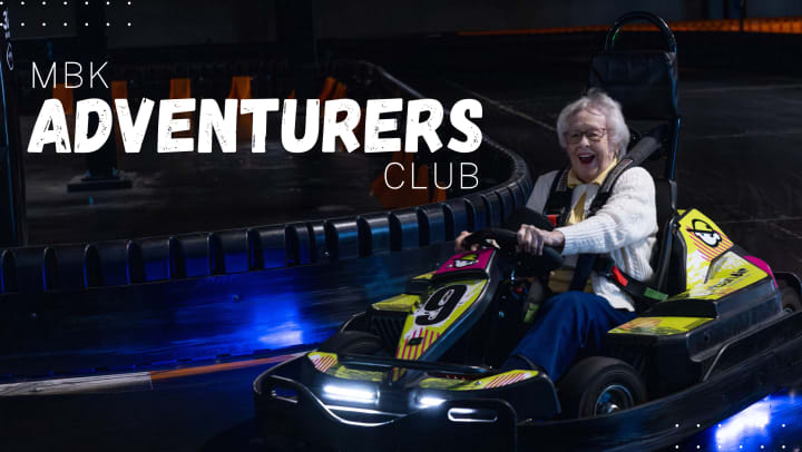 Senior resident riding Go Kart 