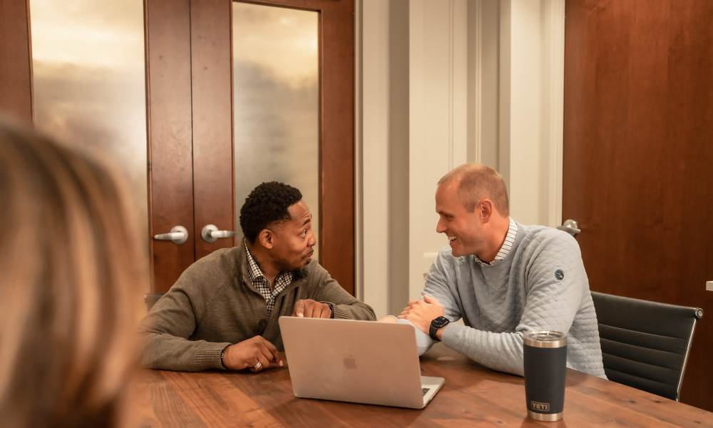 Team members having a meeting in a well-maintained office at Kane Residential in Raleigh, North Carolina