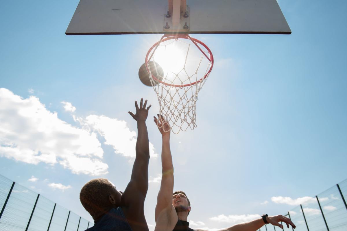 Residents playing basketball outdoors at South Duff in Ames, Iowa
