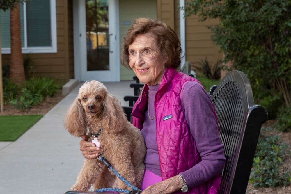 Resident and her adorable dog at Clearwater at Riverpark in Oxnard, California