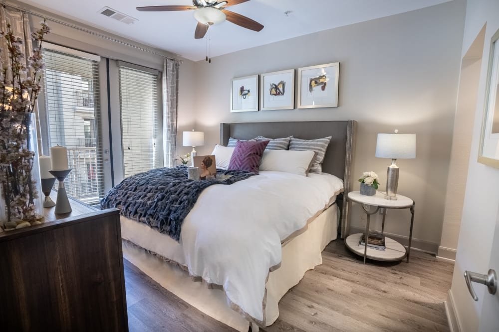 Large primary bedroom with French doors to private balcony at The Core Scottsdale in Scottsdale, Arizona