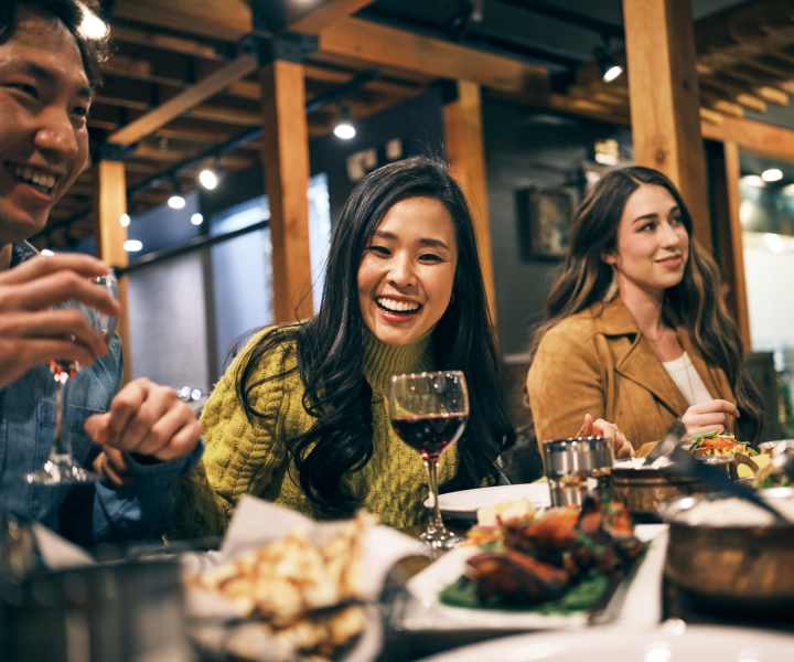Residents enjoying food at a restaurant near Cypress Oaks in Leesburg, Florida