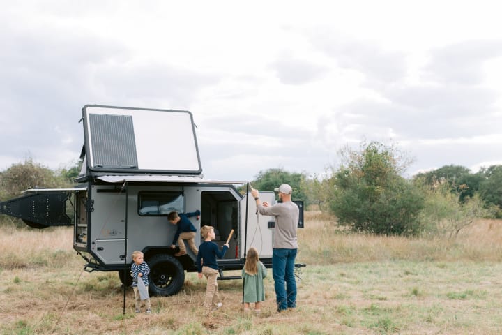 Adventure ATX Rentals family setting up camper canopy