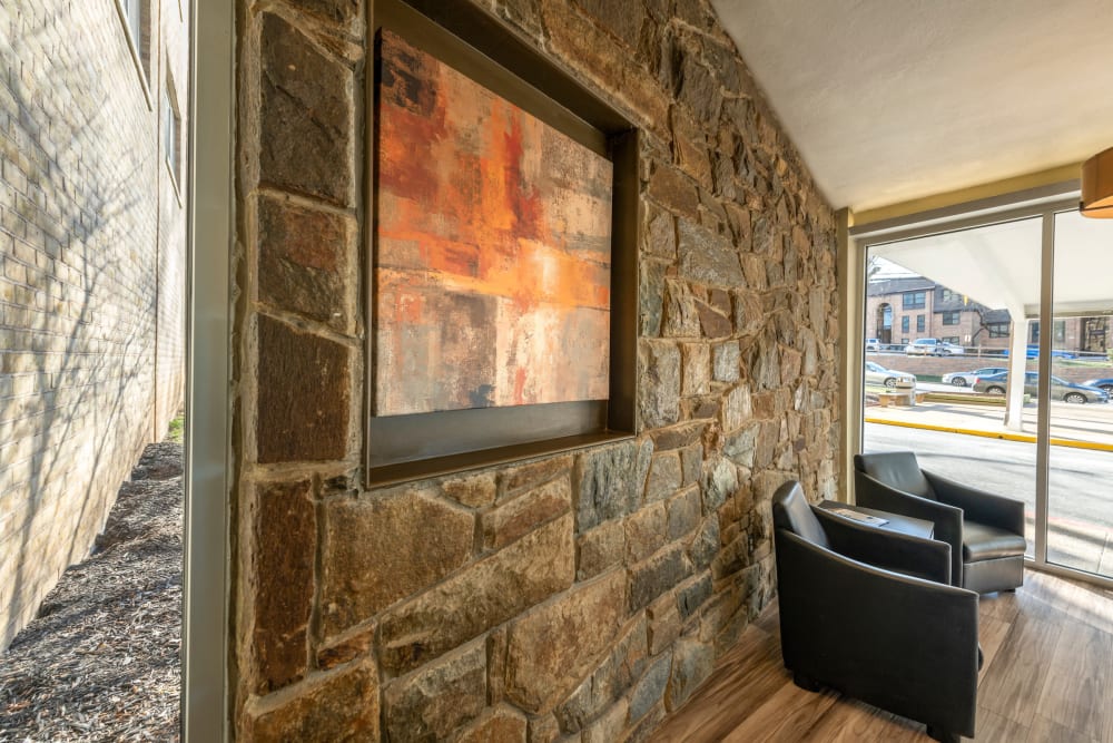 Stone wall and art in the lobby at Ruxton Tower in Towson, Maryland