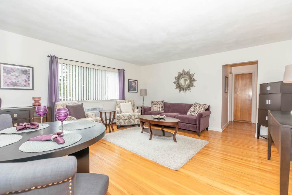 Living room at Greece Commons Apartments in Rochester, New York