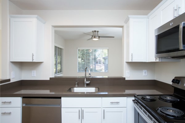 Kitchen featuring white cabinets at Adagio in Sacramento, California