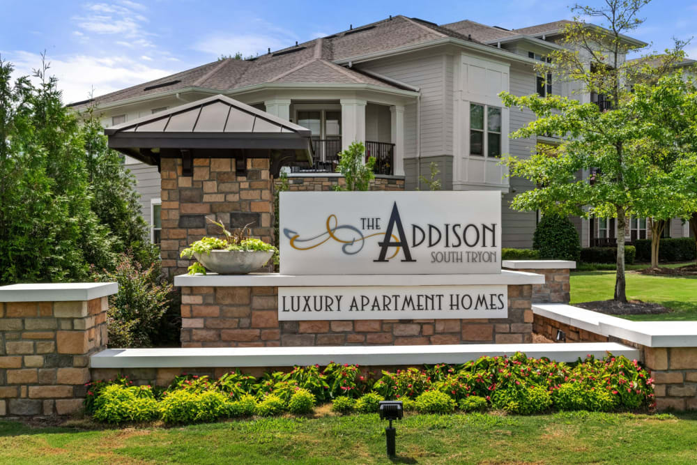 Entry sign at The Addison at South Tryon | Apartments & Townhomes in Charlotte, North Carolina