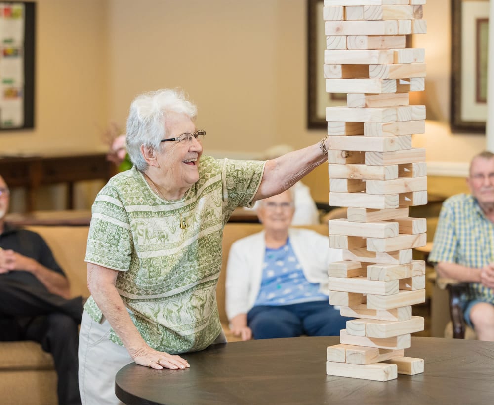 A resident and caretaker painting at Touchmark in the West Hills in Portland, Oregon