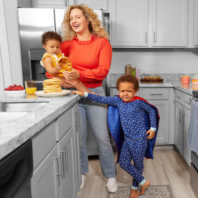 A resident and her kids in the kitchen at BB Living at Union Park in Phoenix, Arizona