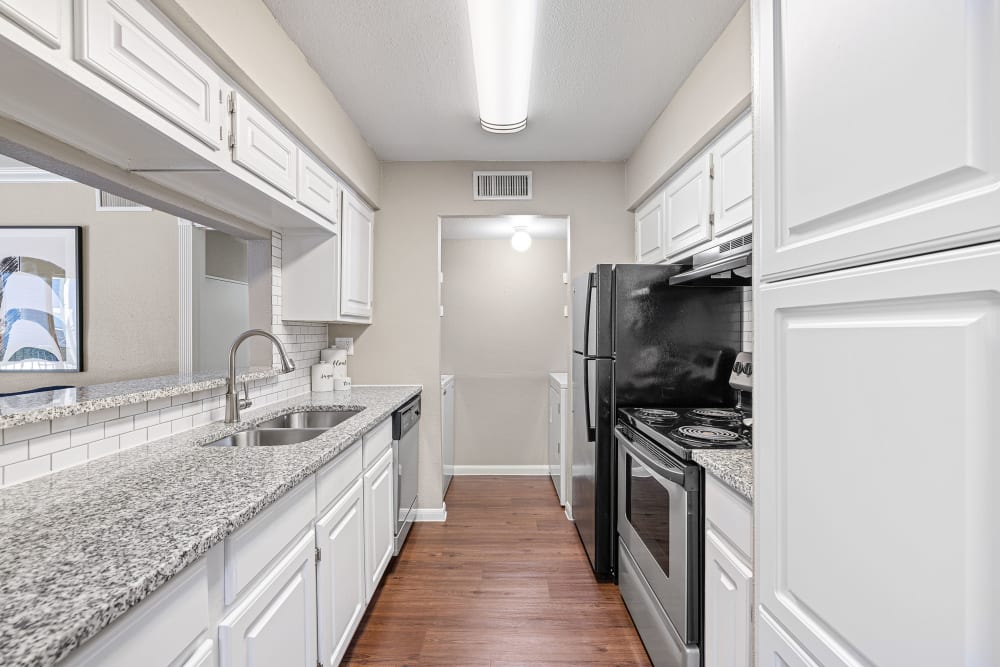 Bright kitchen with gorgeous countertops at Austin Midtown in Austin, Texas
