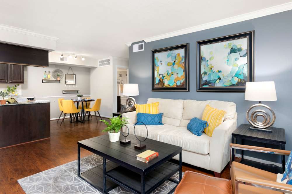 Beautiful living room with black color center table at The Abbey At Enclave in Houston, Texas