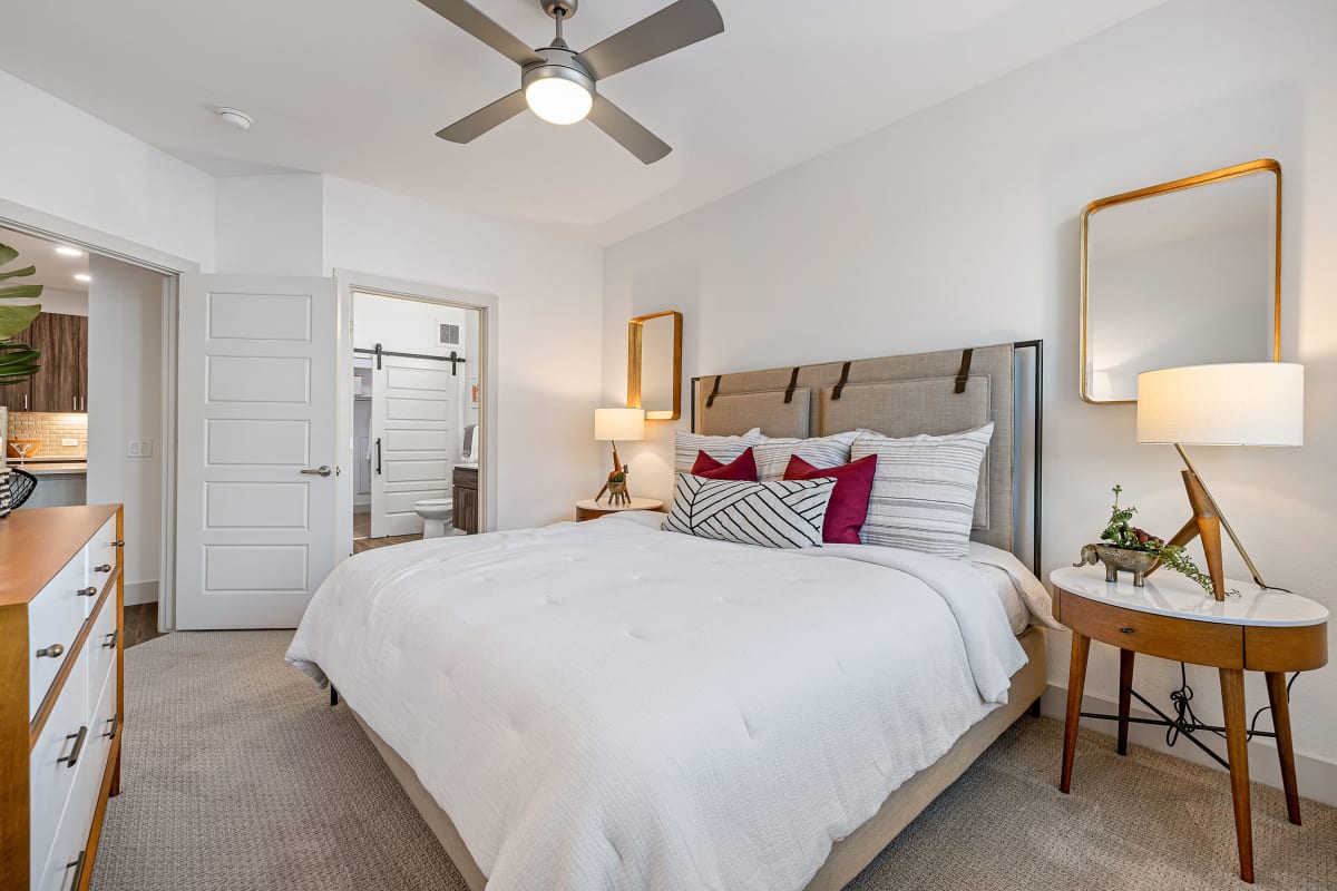 Carpeted bedroom with large windows at Marquis at Chandler in Chandler, Arizona