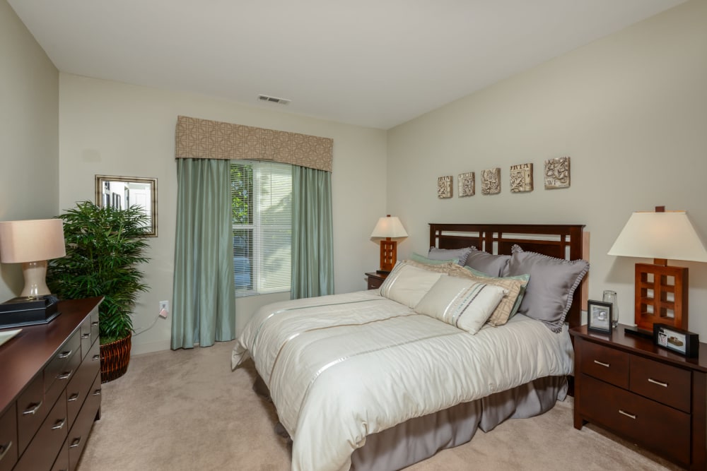 Carpeted bedroom with large window at Sofi Danvers in Danvers, MA