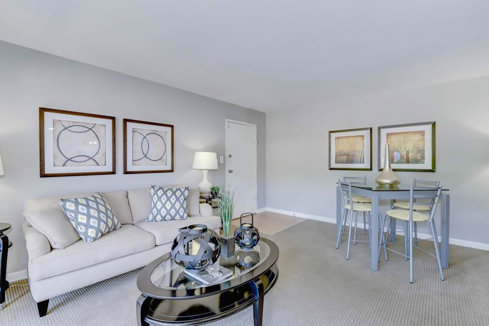 Model living room and dining table at Hampton Manor Apartments & Townhomes in Cockeysville, Maryland