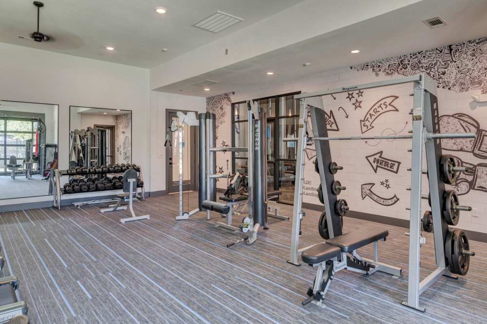 One-Bedroom Luxury Apartments In South Austin, TX - Landing at Double Creek - State-of-the-Art Fitness Center with Free Weights, Full Body Mirrors, And Workout Machines.
