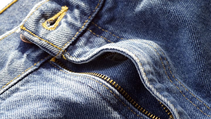 Pair of jeans about to made into cutoffs in a resident home at The Davis in Fort Worth, Texas
