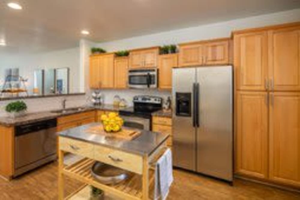Kitchen with wooden cabinets at The Fleetwood in Tempe, Arizona
