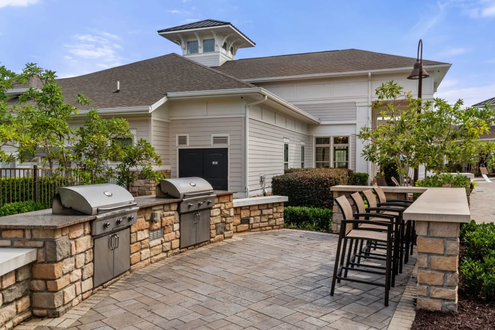 BBQ grilling area at The Addison at South Tryon | Apartments & Townhomes in Charlotte, North Carolina
