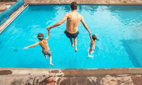 Jumping into the pool at Sequoyah Apartments in Concord, California