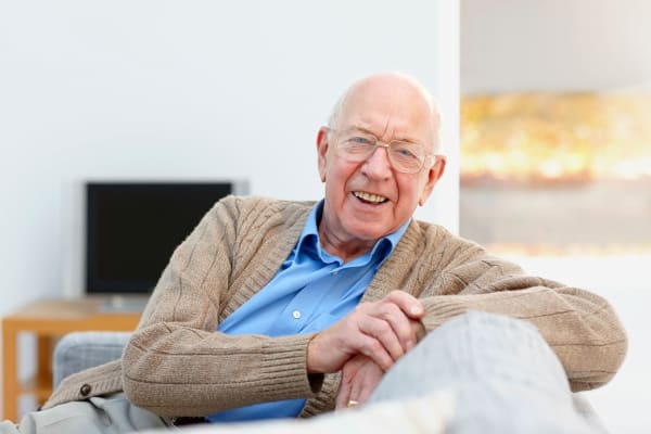 Independent living Senior resident enjoying his stay & relaxing at Grand Plains in Pratt, Kansas