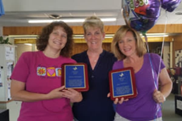 Caregivers receiving awards at Chestnut Knoll at Home.