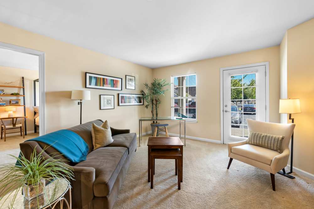 Living Room with Brown Sofa, Glass-topped Coffee Table at Arbor Brook in Murfreesboro, Tennessee