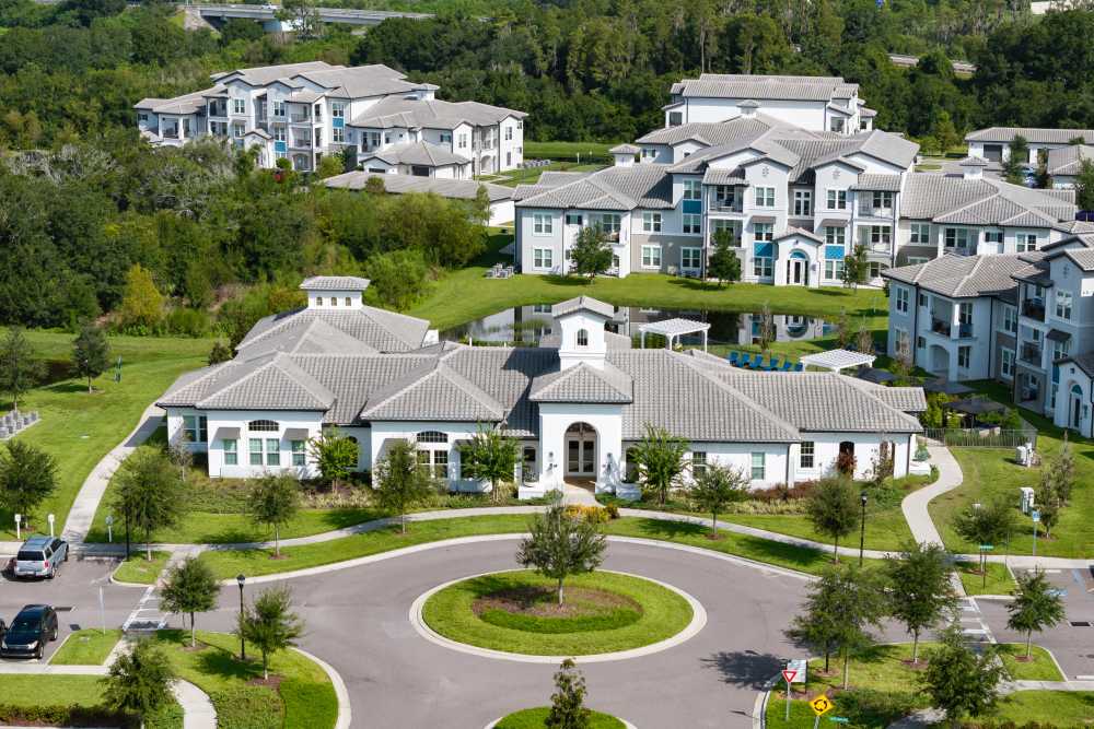 Community aerial view with lake at Shadetree Apartments in Ruskin, Florida