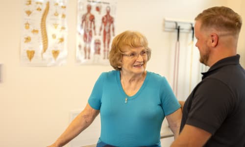Resident out walking with a caretaker at Barclay House of Augusta in Augusta, Georgia