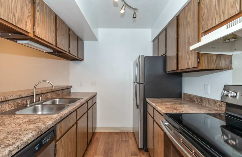 Fully equipped kitchen with sleek stainless appliances at Parkside at Castleton Square in Indianapolis, Indiana