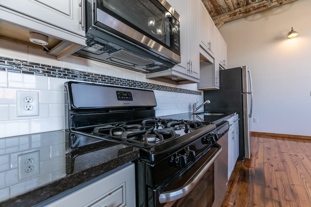 Well appointed kitchen space at Brumby Lofts in Marietta, Georgia features stainless steel appliances.