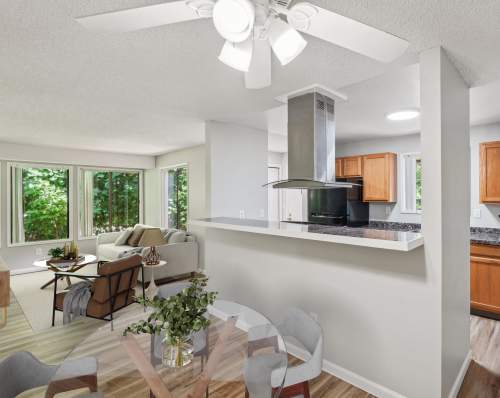 Kitchen appliances with dining and living area at Oakbrook Apartment Homes in Vancouver, Washington