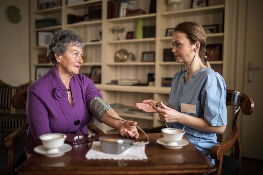 Resident consulting with site nurse at Westminster Memory Care in Lexington, South Carolina