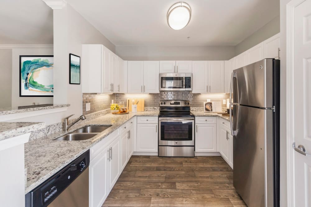 Kitchen with lots of counter space and new stainless steal appliances at Sofi at Salem Station in Salem, Massachusetts
