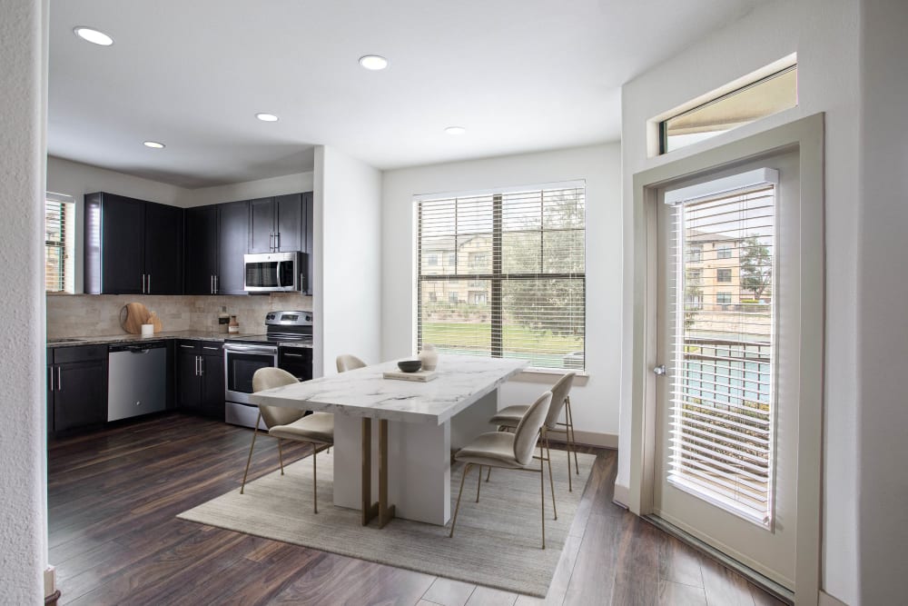 Beautiful living space and open concept kitchen at Olympus Falcon Landing in Katy, Texas