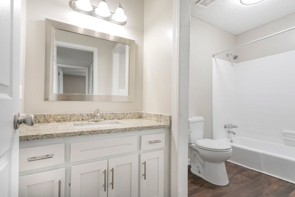 Bathroom with granite counters at Parkview Flats Apartments in Murfreesboro, Tennessee