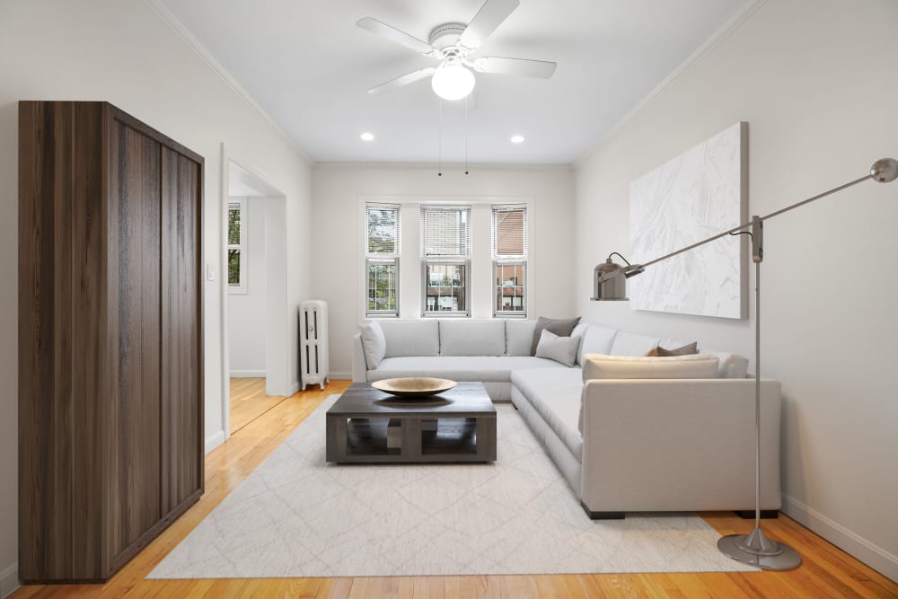 Living area with wood-style flooring at Atrio Boston in Boston, Massachusetts