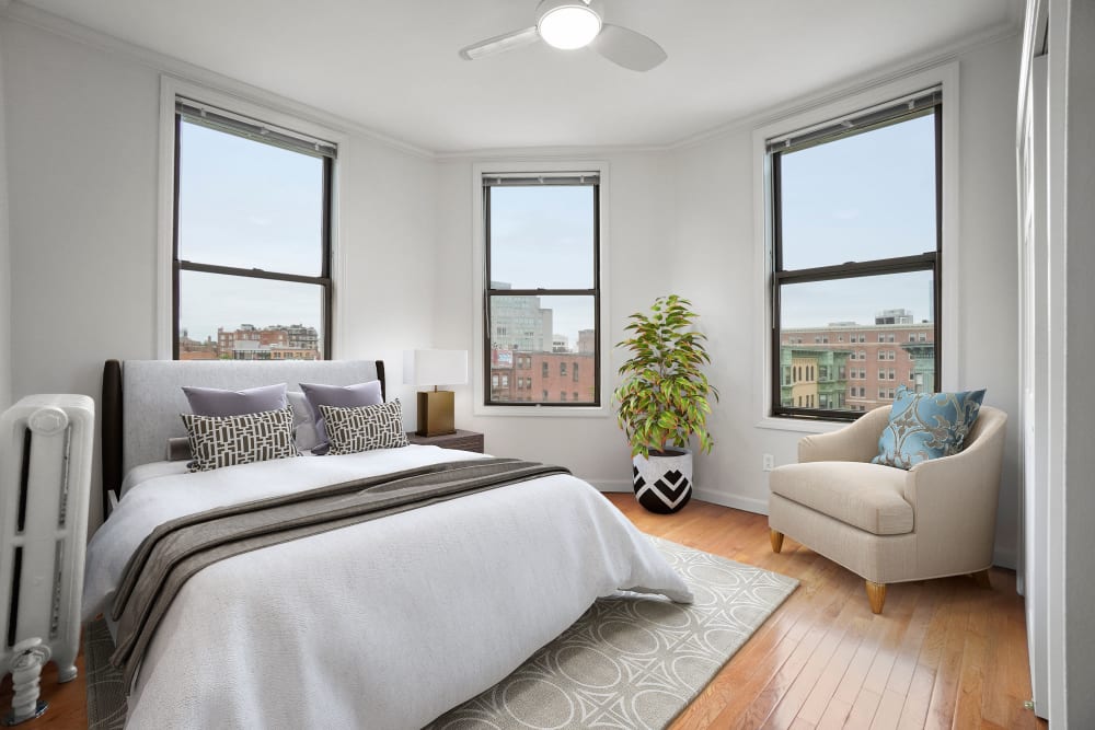 Bedroom with large windows at Atrio Boston in Boston, Massachusetts