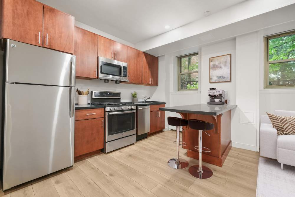 Modern kitchen in a one bedroom apartment at Camelot Court in Brighton, Massachusetts