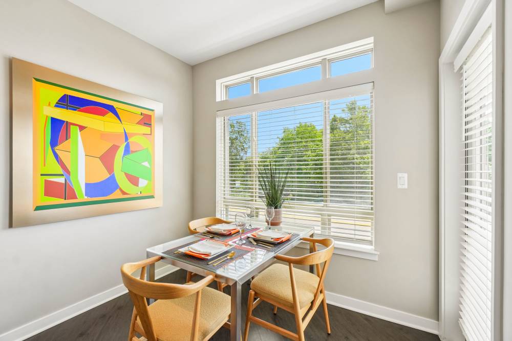 Dining area with table and artwork at Uptown Ann Arbor in Ann Arbor, Michigan
