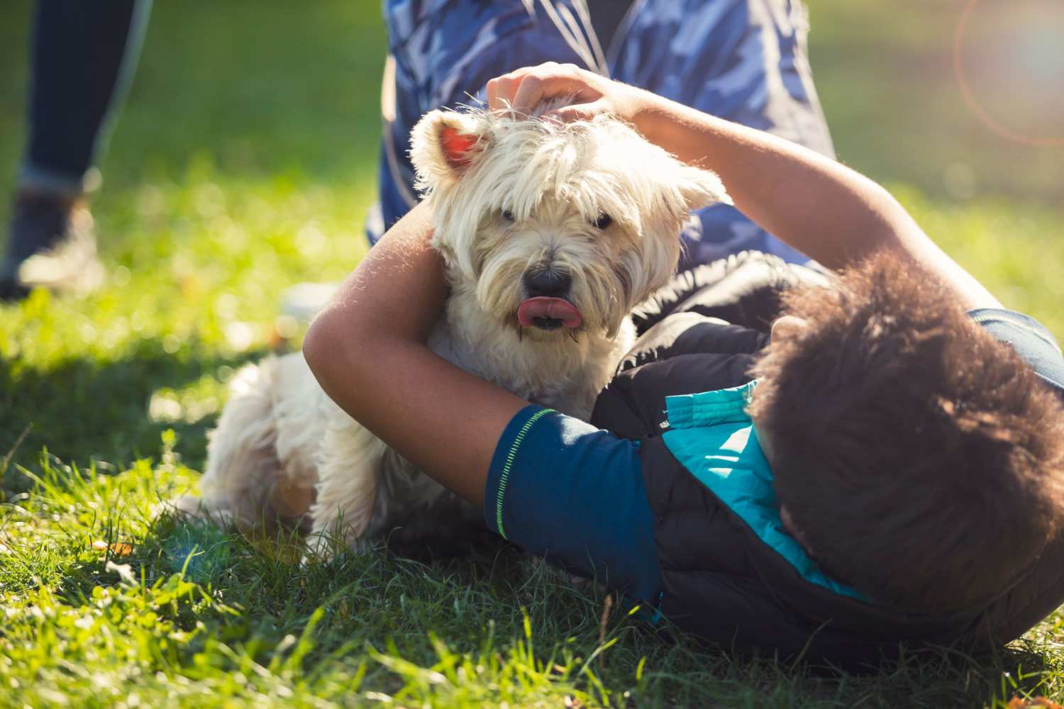 A resident laying with their dog at The Emerson at Forney Marketplace in Forney, Texas