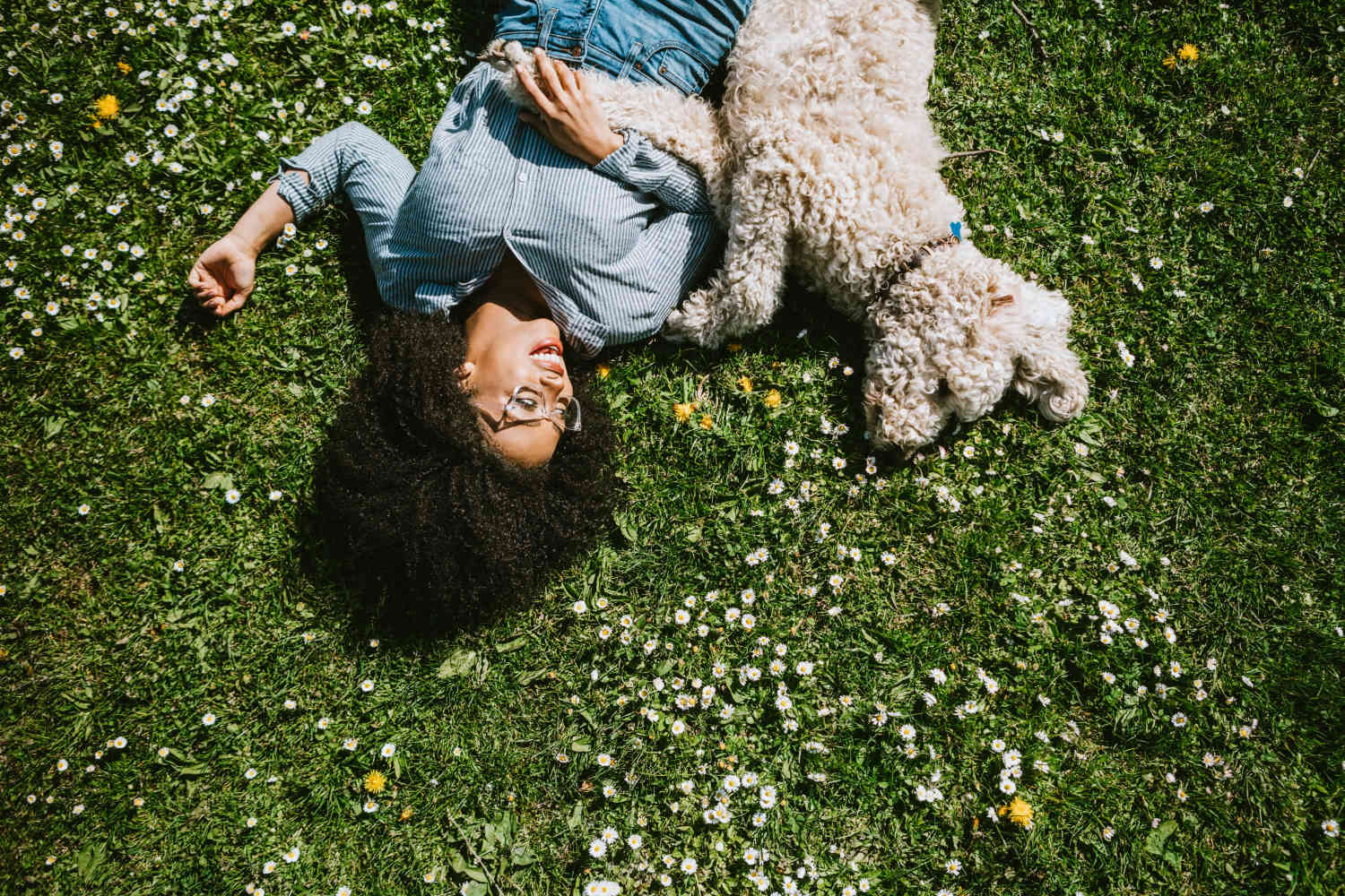 Resident lying with her pup in a park near Coastal Club Apartments in Brunswick, Georgia