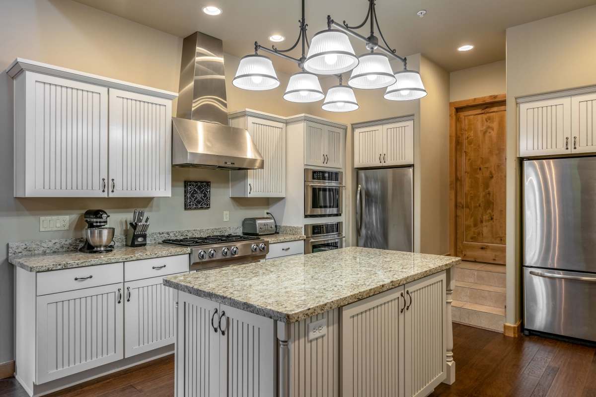 Sleek, modern kitchen with island at Roosevelt Park Apartments in San Jose, California