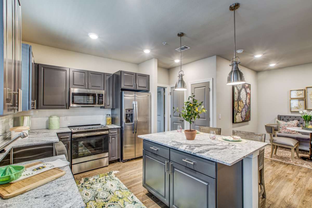 Kitchen and Living room at Watermere at Woodland Lakes in Conroe, Texas